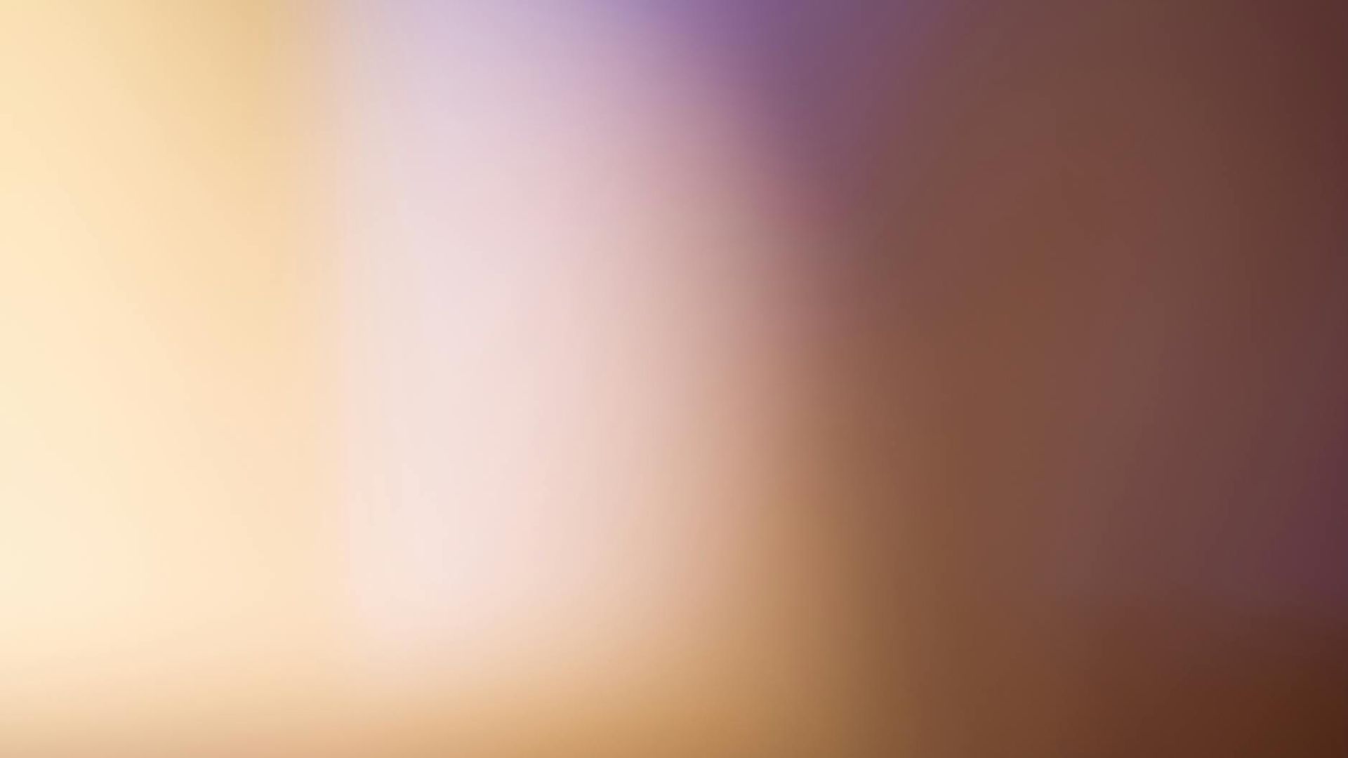 Abstract soft focus background with gentle light gradients.